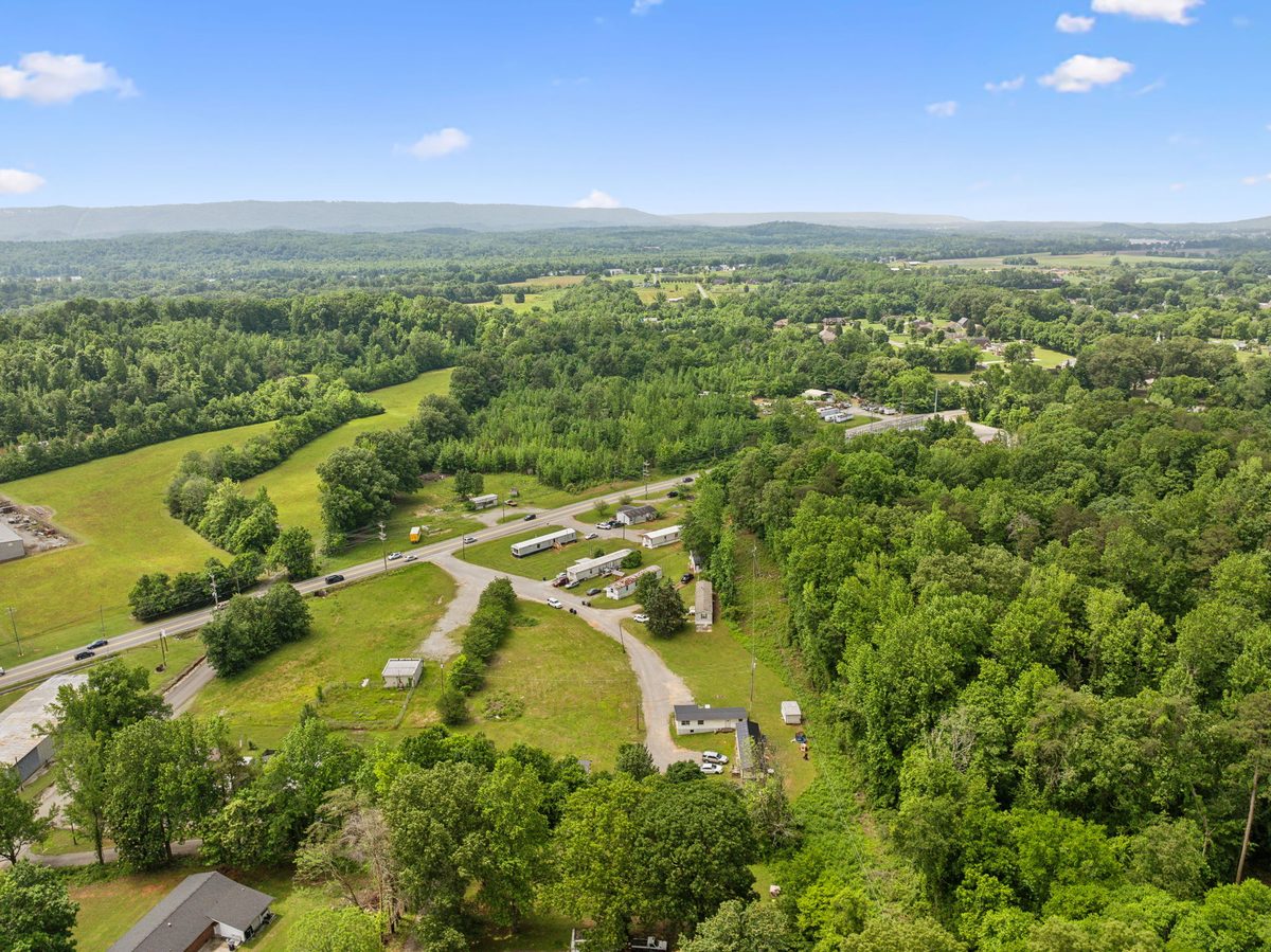 Aerial view of the community and surrounding low-density neighborhood