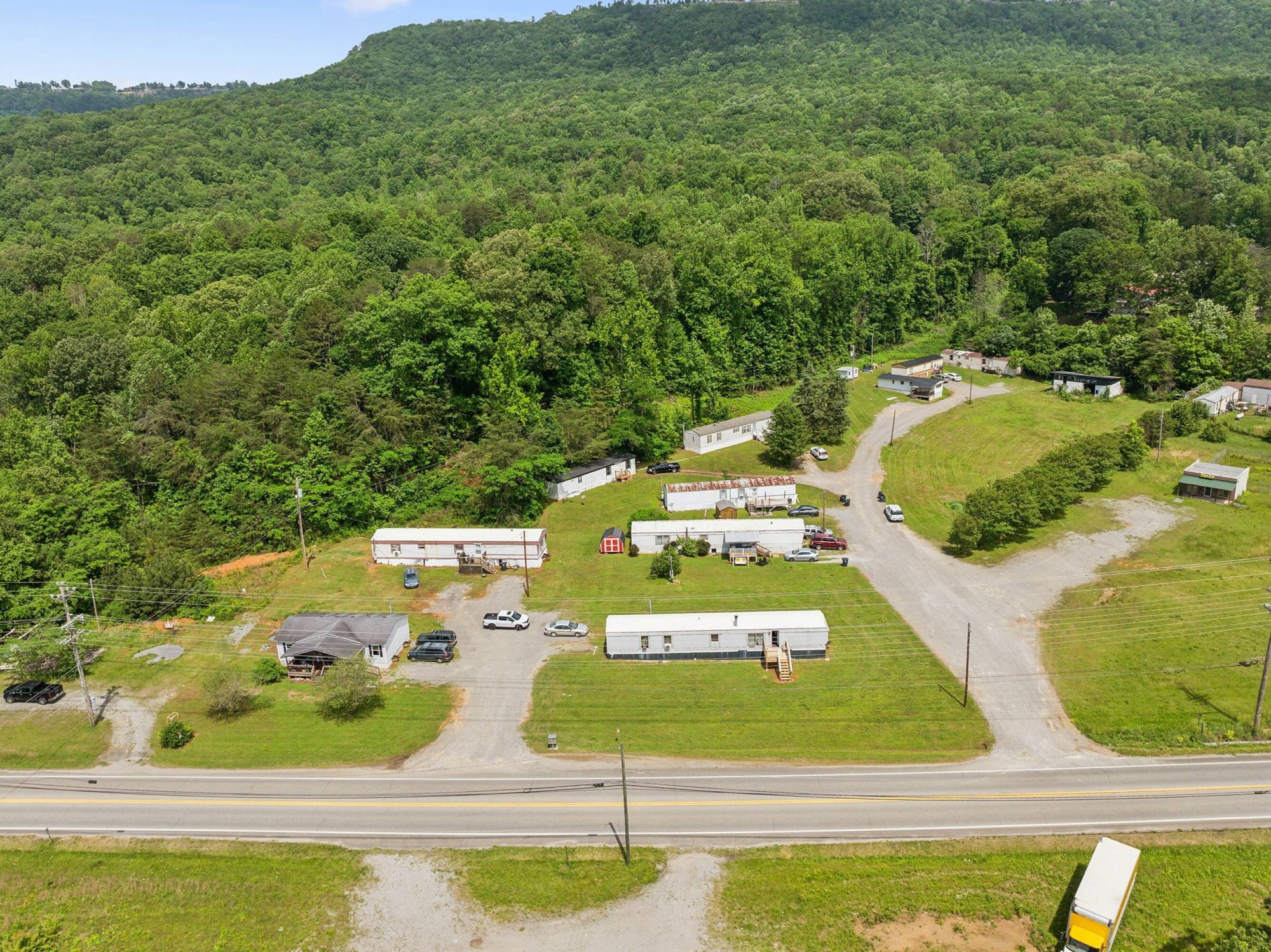 Aerial view of Tennessee Southern Scout MHP, a ten-pad mobile home community fronting US Highway 41 (Main Street) in Kimball, Tennessee