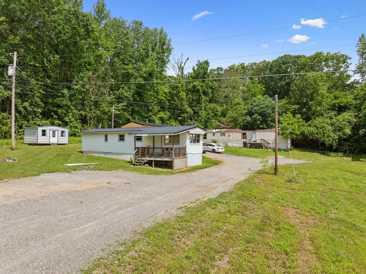 Park-owned single-wide home with entry deck
