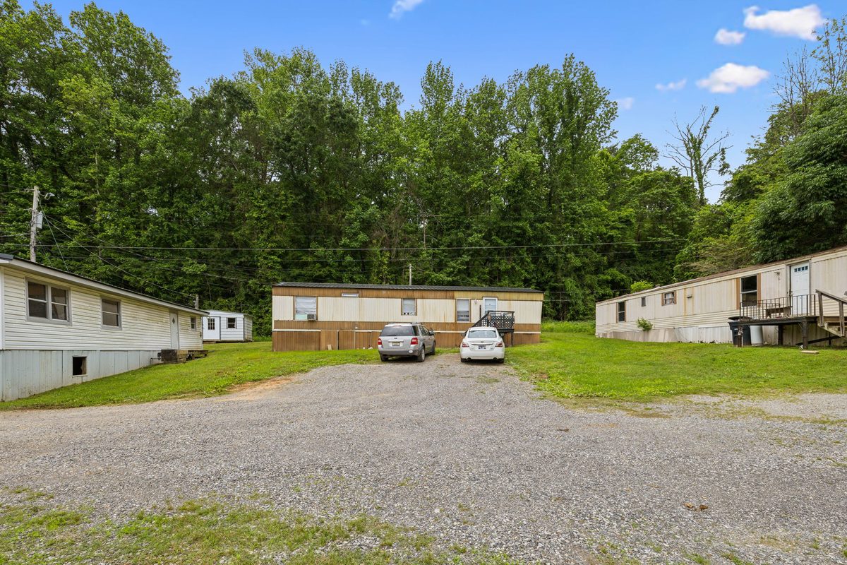 Park-owned homes and shared gravel parking area