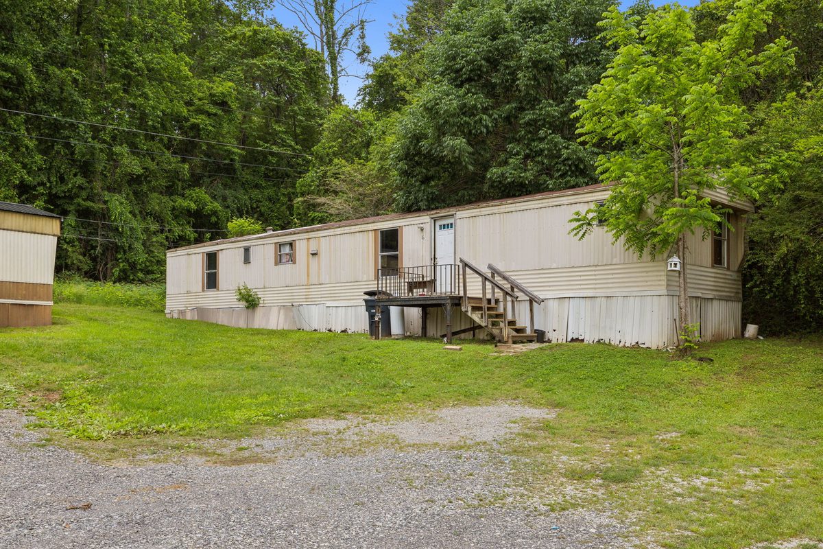 Single-wide park-owned home with entry steps